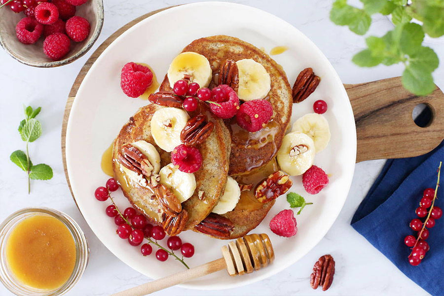 Banana buckwheat pancakes with raspberries and Mānuka honey
